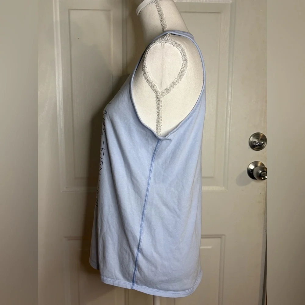 Nike light blue tank top with logo pattern. Size Medium.
